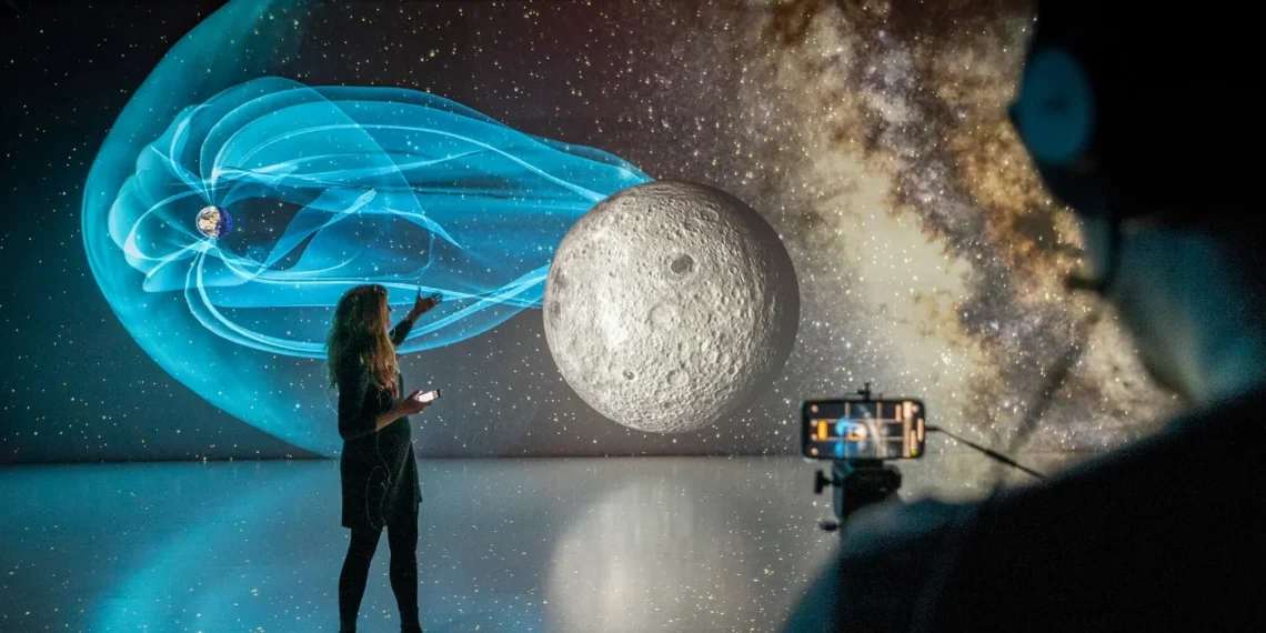 Interactive space-themed digital installation at Ars Electronica Center in Linz featuring a projection of the Moon and Earth’s magnetic field.