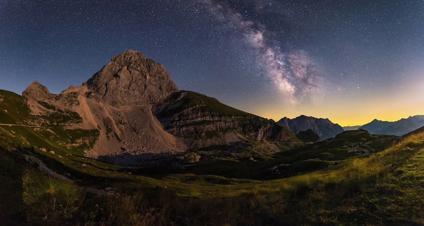 Mangart under a starry sky and the Milky Way in the Julian Alps, Slovenia